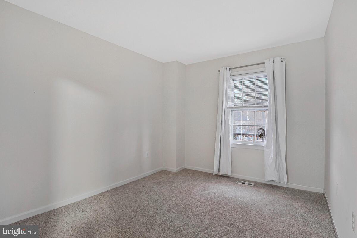 7865 Parthian Court Springfield, VA 22153 - Photo 15 of 40 an empty room with windows