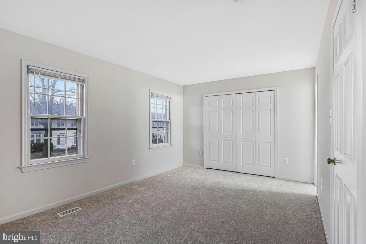 7865 Parthian Court Springfield, VA 22153 - Photo 17 of 40 a view of empty room with windows