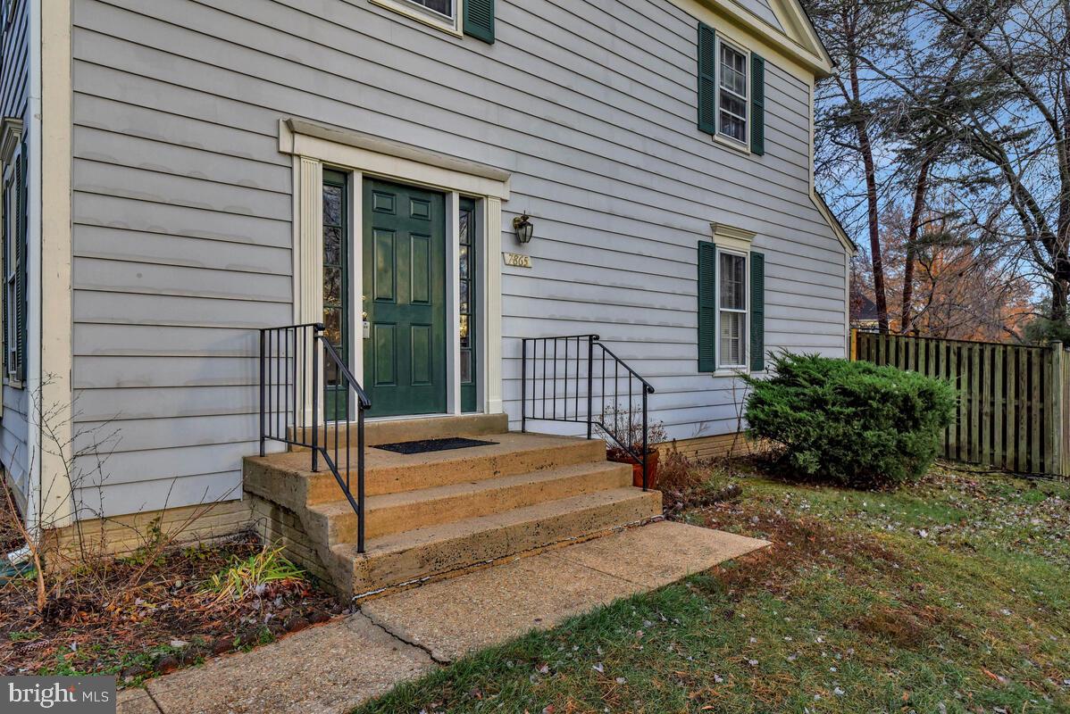 7865 Parthian Court Springfield, VA 22153 - Photo 2 of 40 a view of a backyard with a sitting area and garden