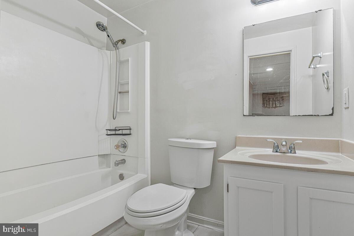 7865 Parthian Court Springfield, VA 22153 - Photo 28 of 40 a bathroom with a sink toilet and shower