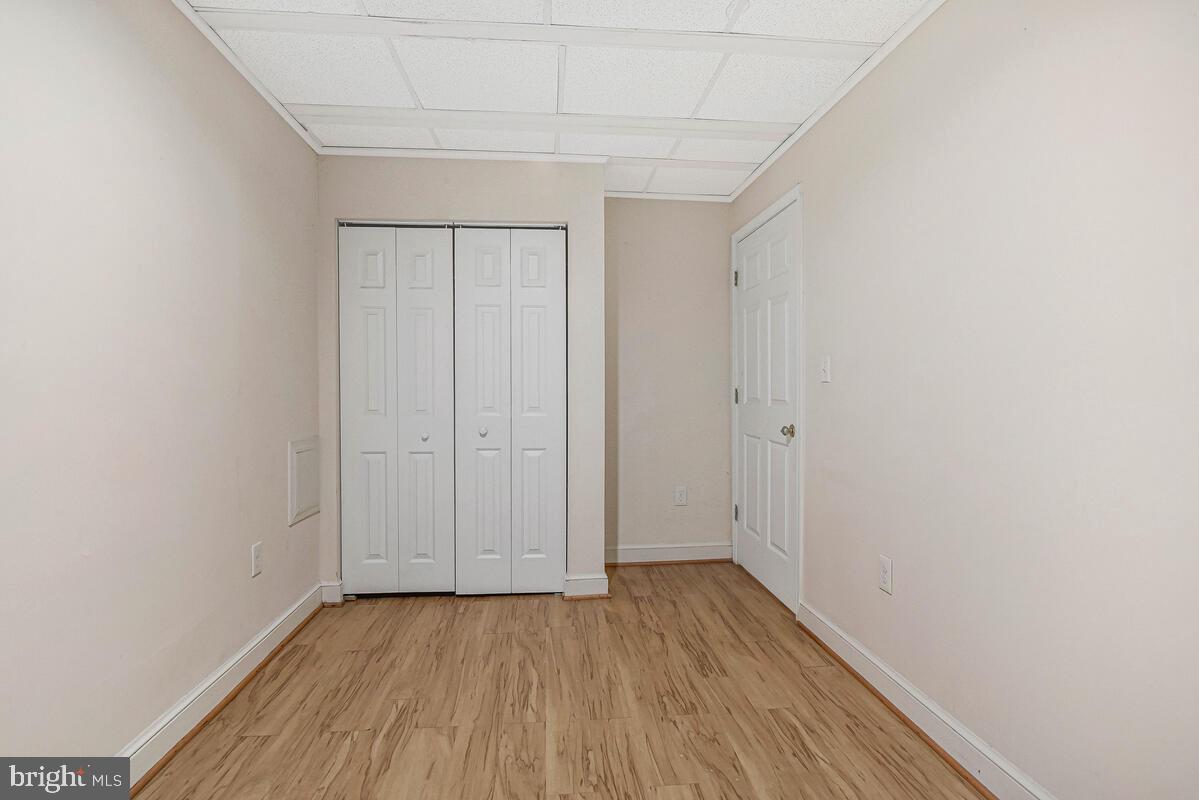 7865 Parthian Court Springfield, VA 22153 - Photo 30 of 40 a view of an empty room with wooden floor