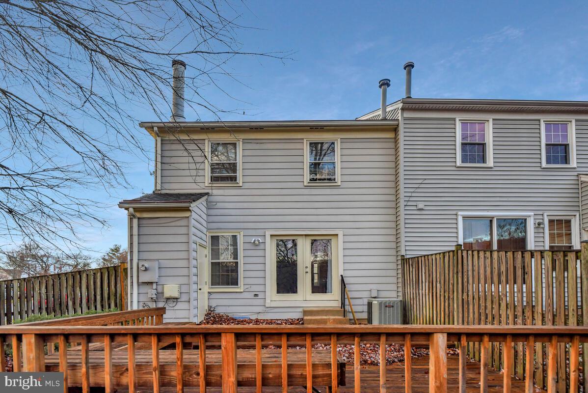 7865 Parthian Court Springfield, VA 22153 - Photo 35 of 40 a front view of a house with a glass door