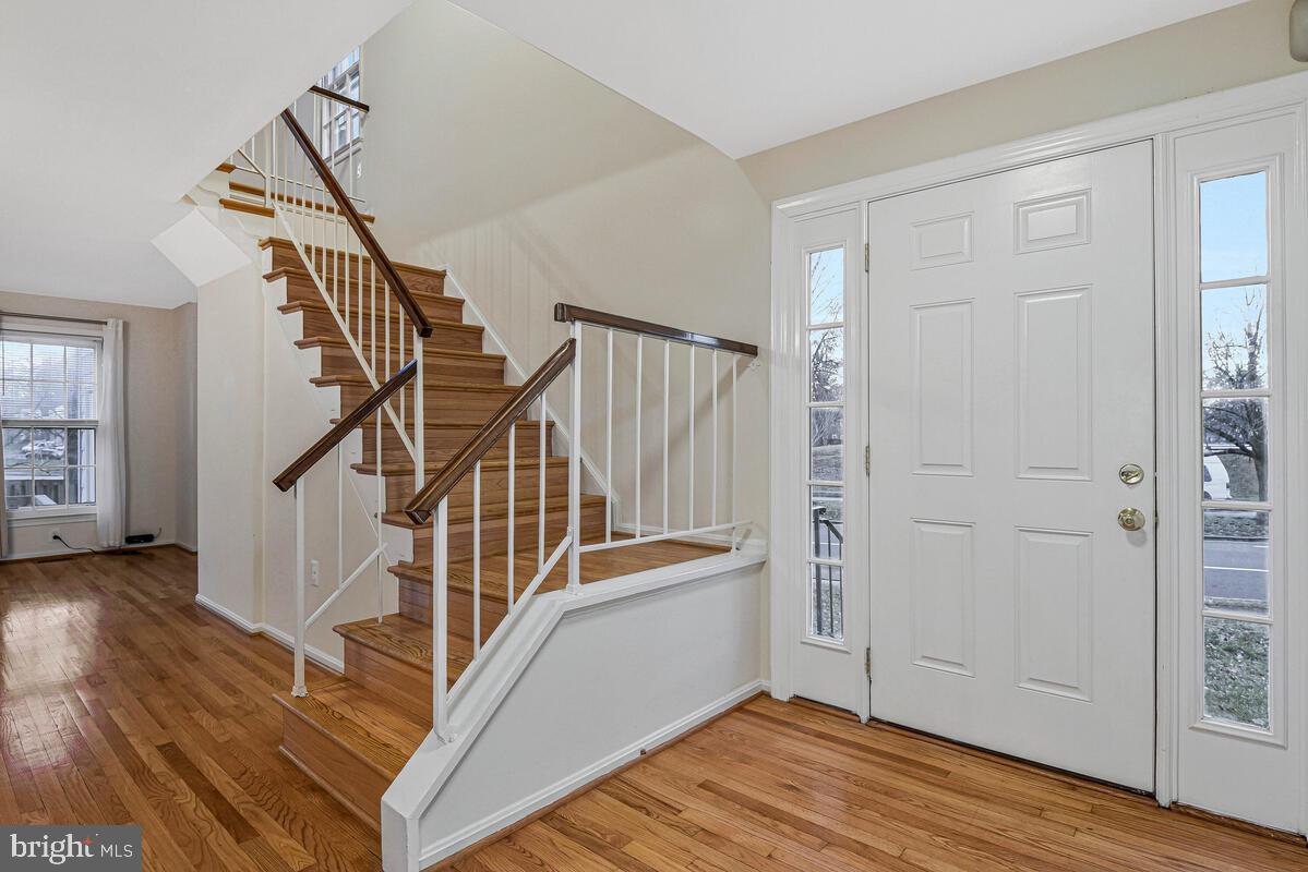 7865 Parthian Court Springfield, VA 22153 - Photo 4 of 40 a view of entryway and hall with wooden floor
