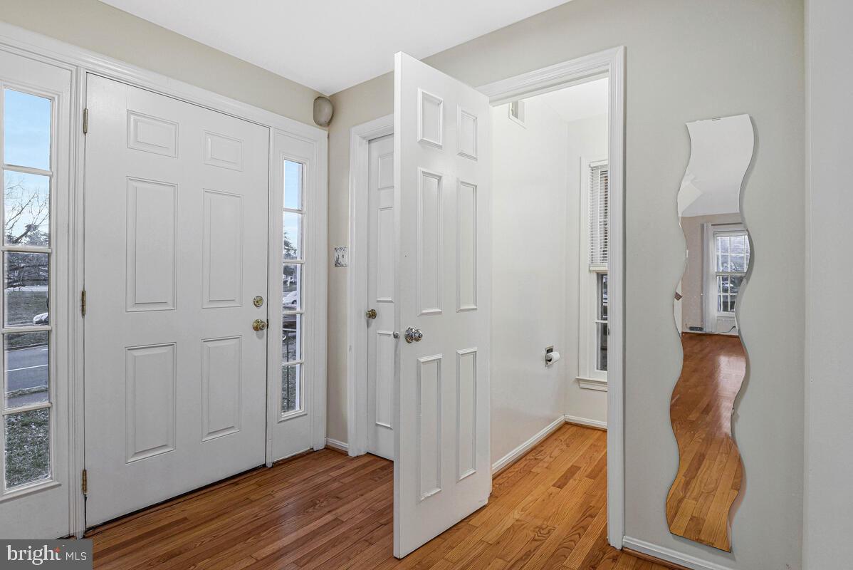 7865 Parthian Court Springfield, VA 22153 - Photo 5 of 40 a view of a bathroom with wooden floor