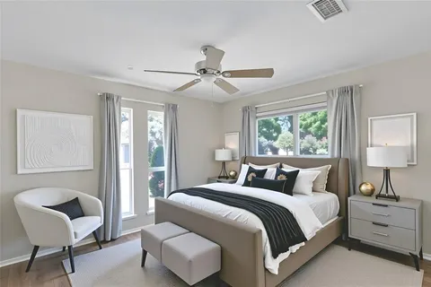 a bedroom with a bed and a chair