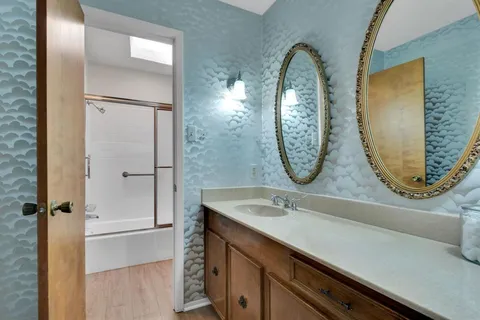 a bathroom with a sink and a mirror