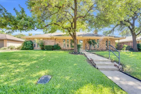 a house view with a garden space