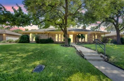 a house view with a garden space