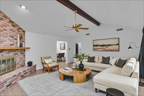 a living room with furniture a fireplace