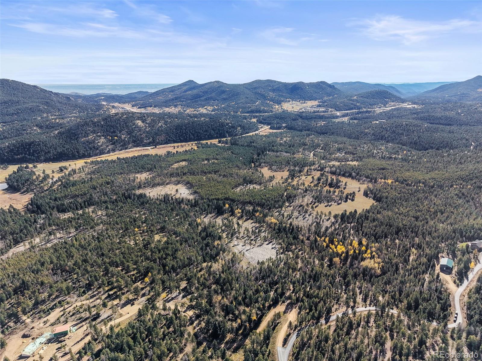 9606 Wallow Court Conifer, CO 80433 - Photo 20 of 27 an aerial view of residential house and green space