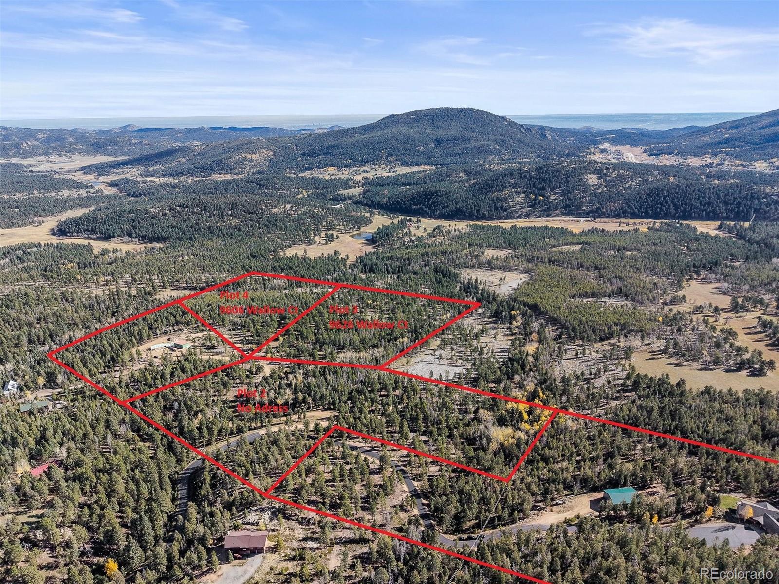 9606 Wallow Court Conifer, CO 80433 - Photo 6 of 27 a city view with lake background and mountain view