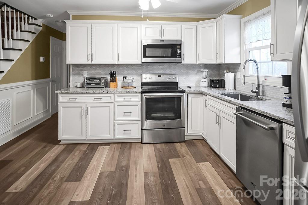 122 Rockman Road Grover, NC 28073 - Photo 19 of 45 a kitchen with a sink stove and cabinets