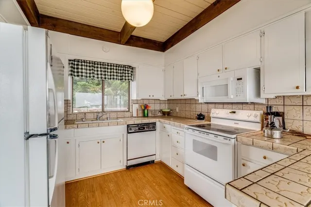 a bathroom with a sink a mirror and a shower