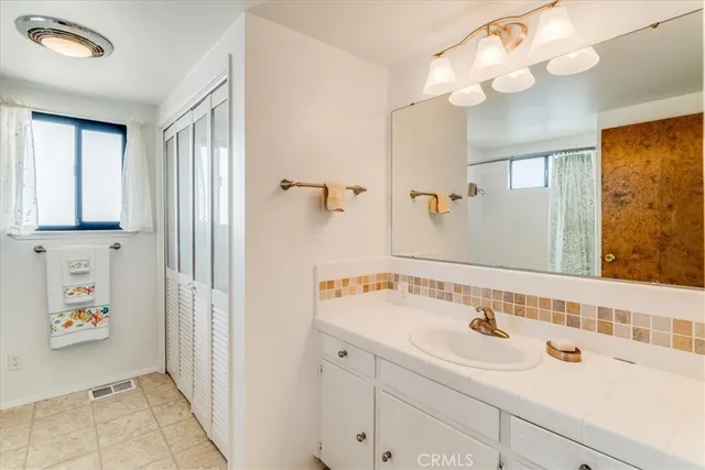 a bedroom with a bed and a lamp with rug