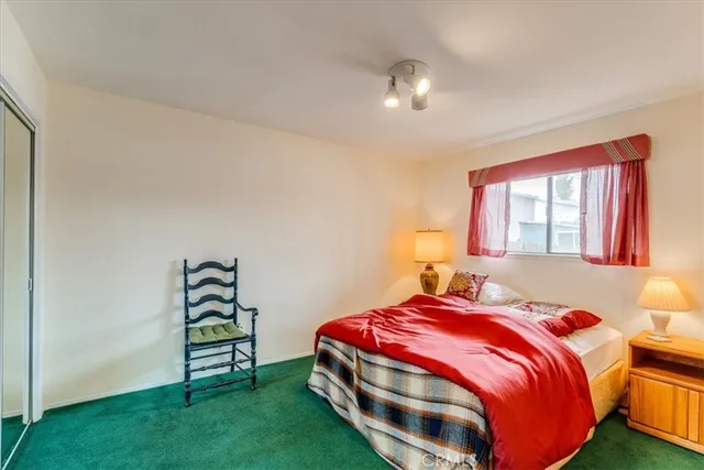 a view of a livingroom with furniture and hardwood floor