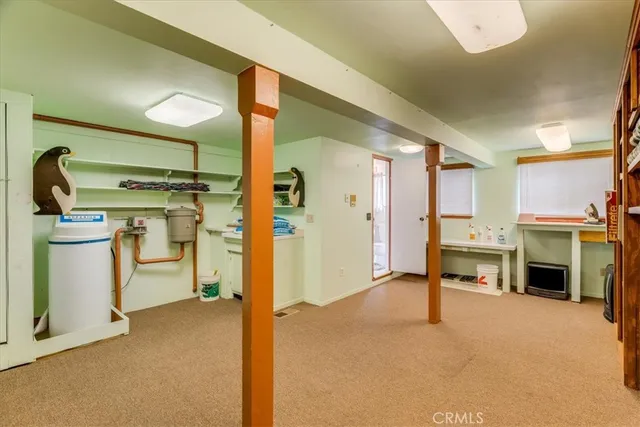 a bedroom with a bed and a tv