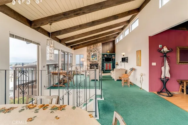 a bedroom with furniture and a large window