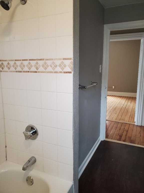762 Globe Street, Unit 2 Fall River, MA 02724 - Photo 16 of 20 a bathroom with a bathtub and shower