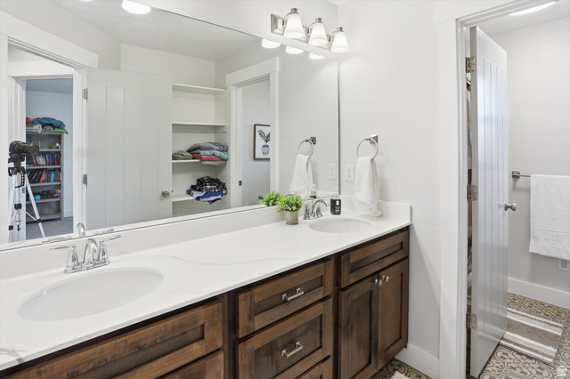 1009 High Creek Road Cove, UT 84320 - Photo 38 of 79 Bathroom featuring a walk in closet and double vanity