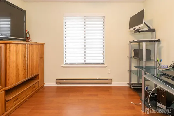 a view of a room with gym equipment and a window