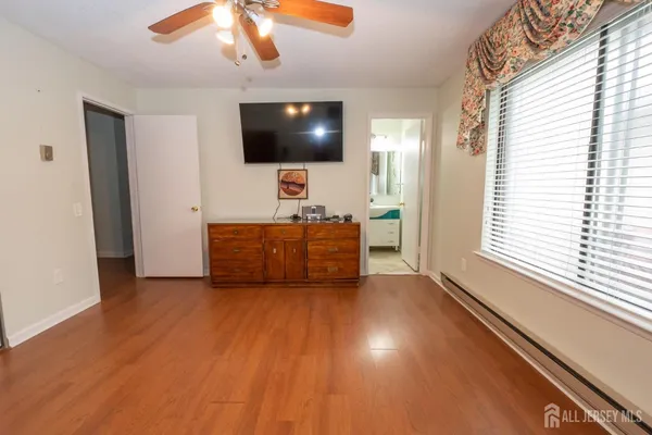 a room with furniture and flat screen tv