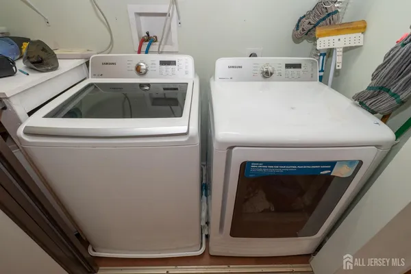 a utility room with dryer and washer