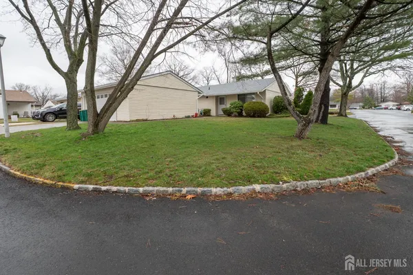 a view of a house with a backyard