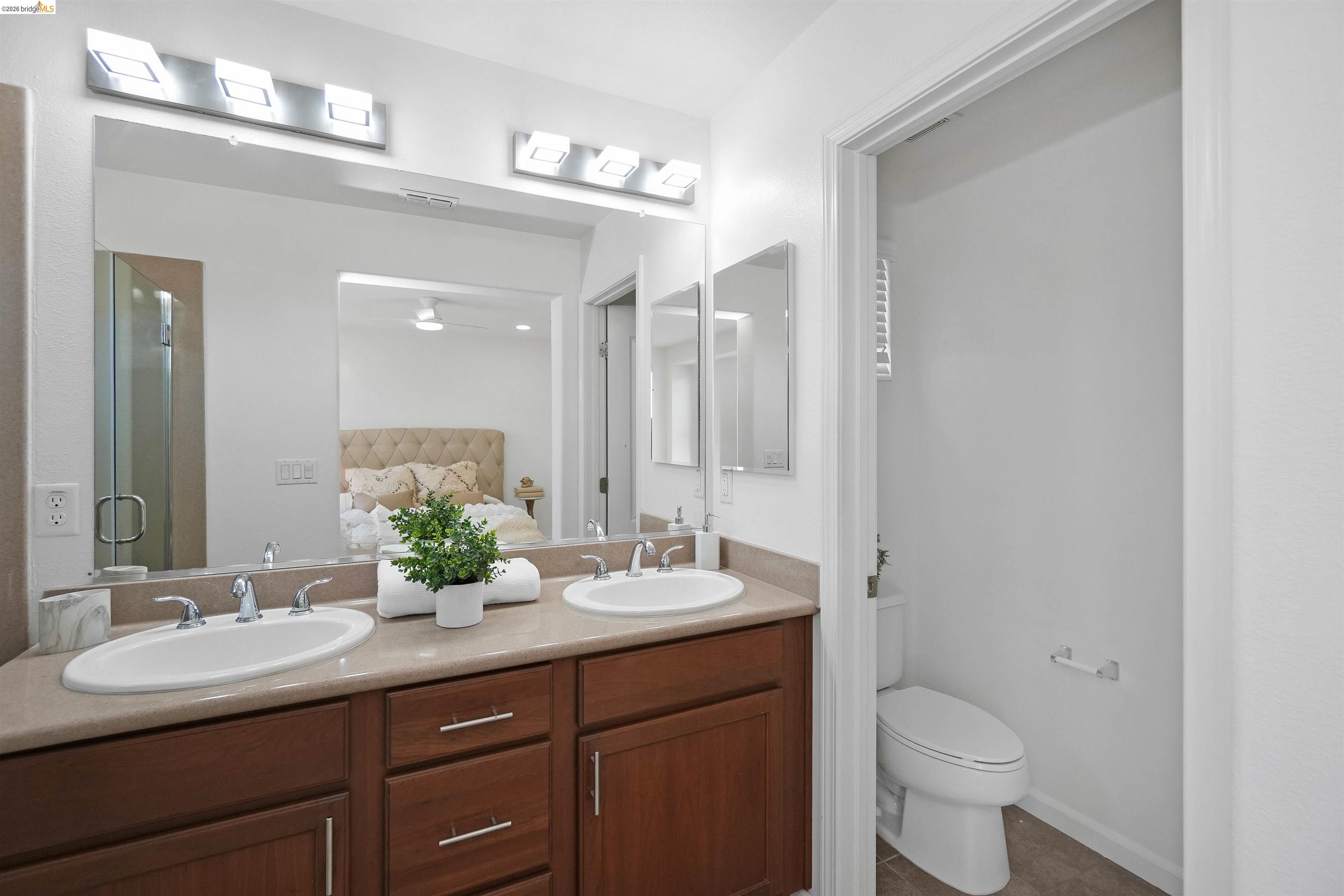 449 Constantine Court San Ramon, CA 94583 - Photo 45 of 63 Double vanity with undermount sinks and chrome fixtures, set in a neutral-toned countertop