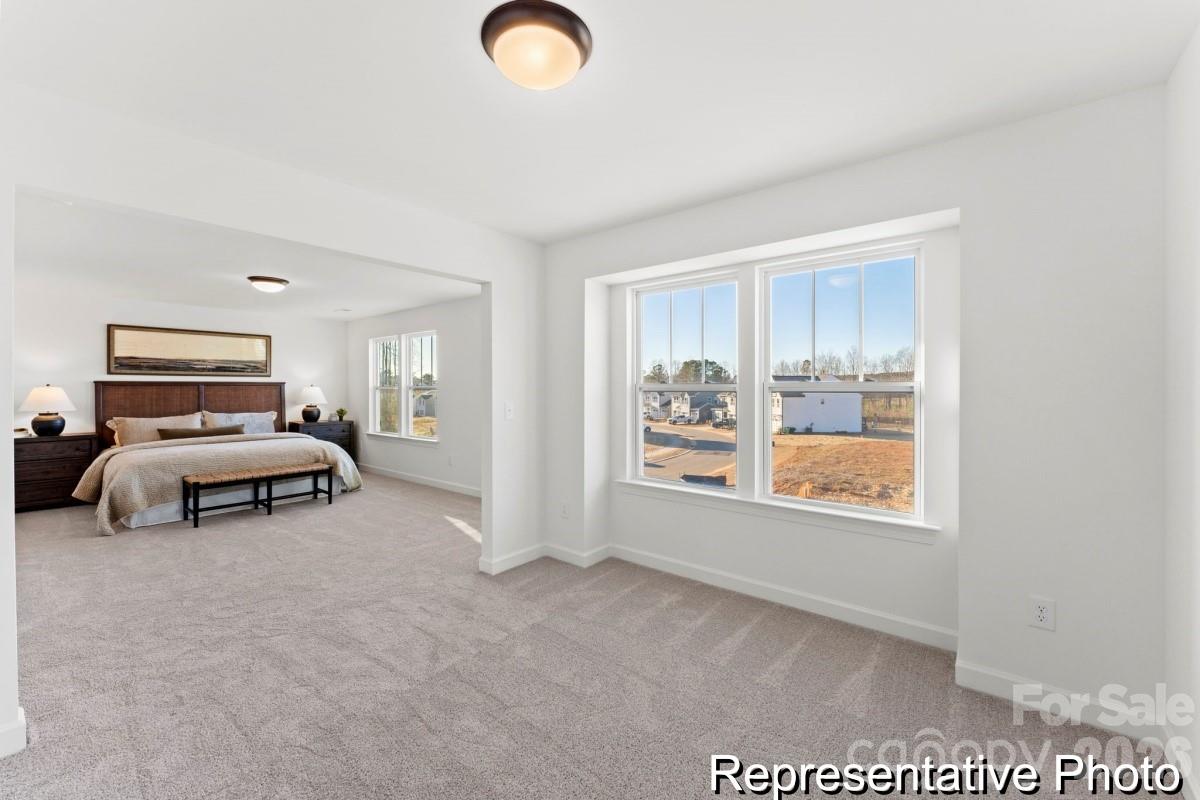 137 Soft Breeze Bend, Unit 283B Locust, NC 28097 - Photo 14 of 21 a view of a livingroom with furniture and windows