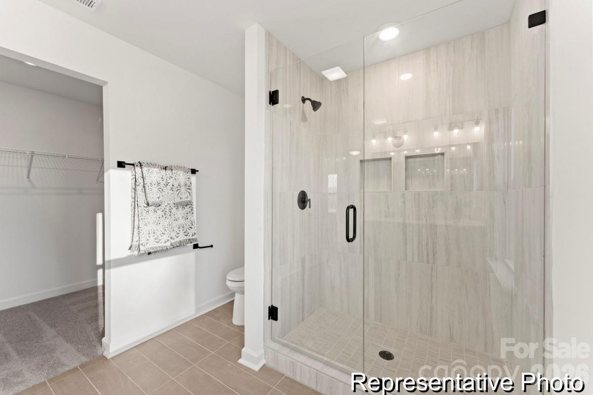 137 Soft Breeze Bend, Unit 283B Locust, NC 28097 - Photo 17 of 21 a bathroom with a shower
