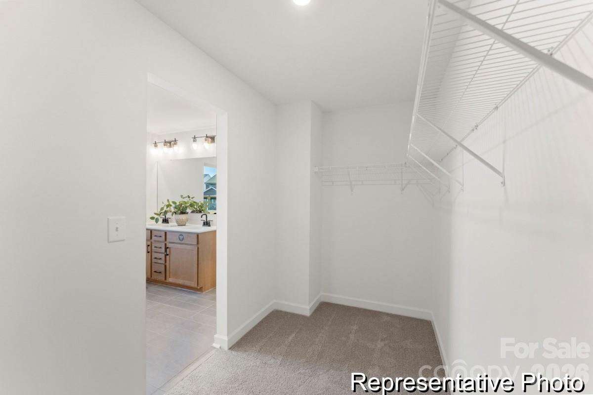 137 Soft Breeze Bend, Unit 283B Locust, NC 28097 - Photo 18 of 21 a view of an empty room and kitchen