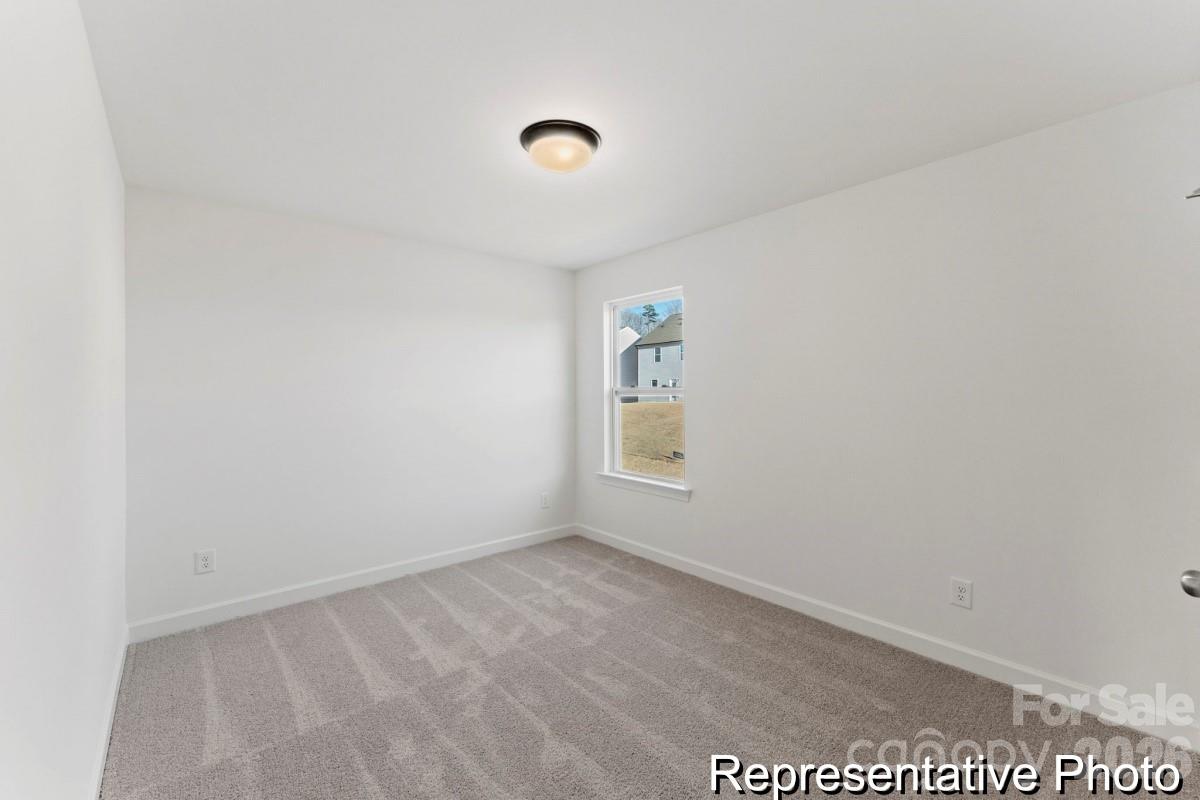 137 Soft Breeze Bend, Unit 283B Locust, NC 28097 - Photo 19 of 21 a view of an empty room