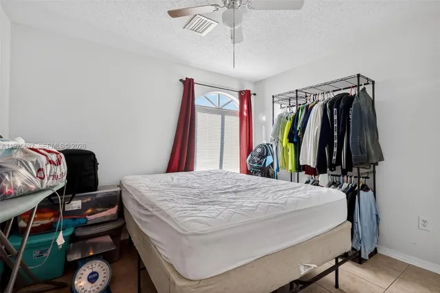 a bed room with a bed and a window