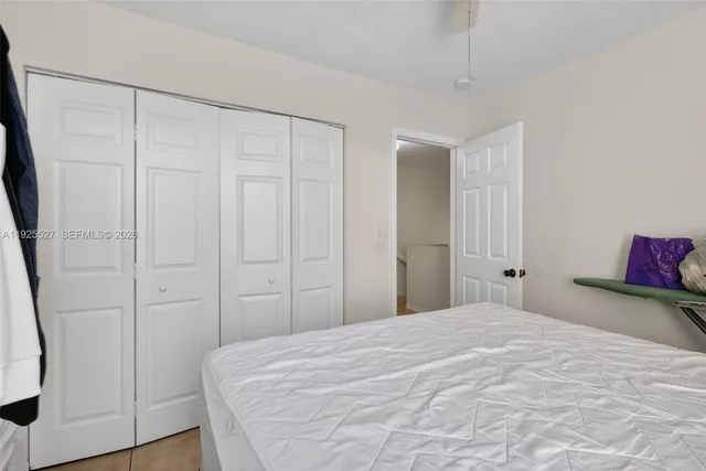 a bedroom with a bed and a shower