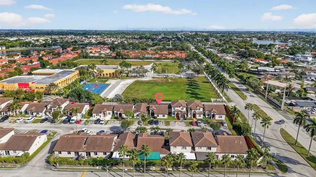 an aerial view of residential houses with outdoor space