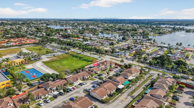an aerial view of residential houses with outdoor space
