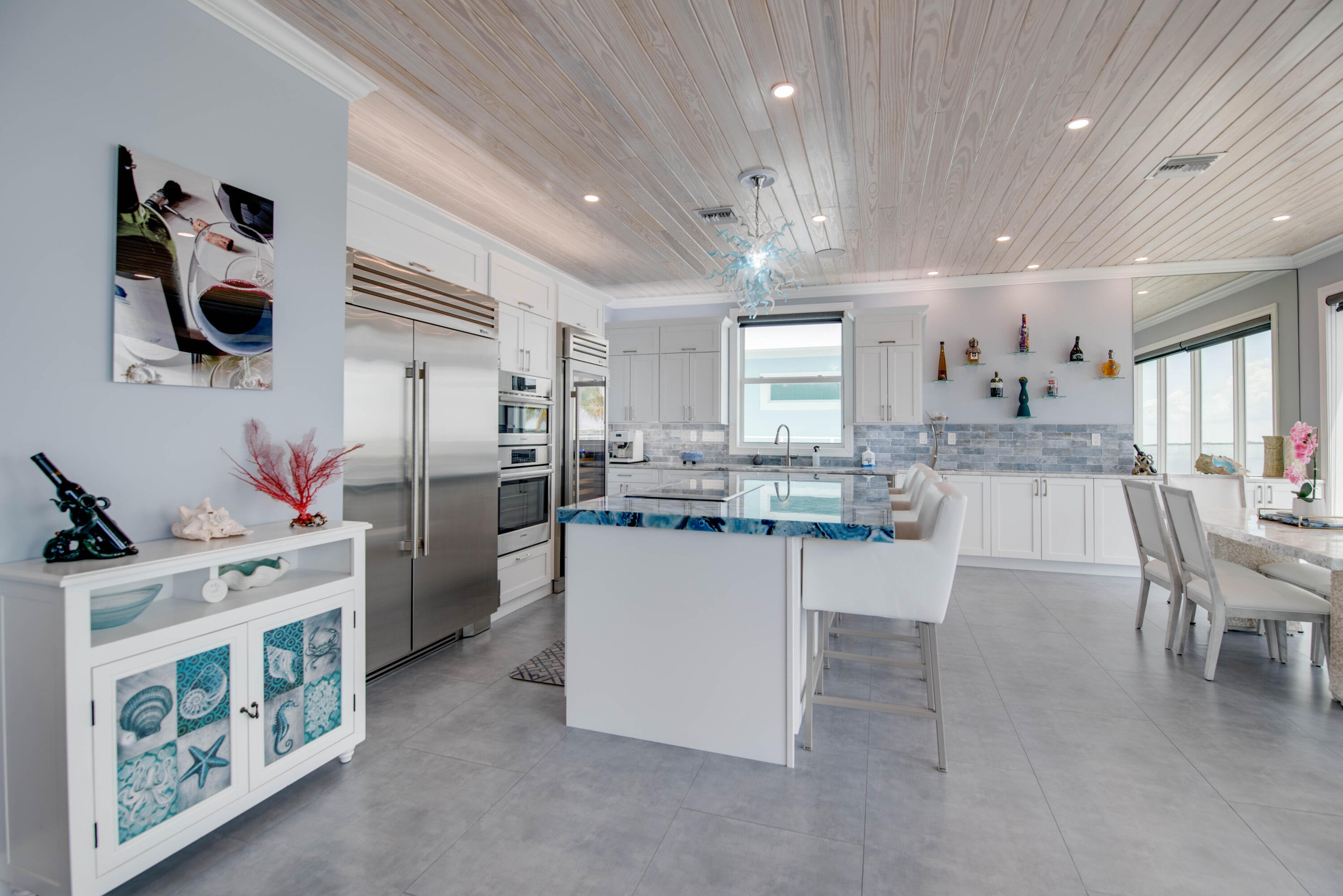 747 La Fitte Road Summerland Key, FL 33042 - Photo 72 of 103 a kitchen with stainless steel appliances kitchen island granite countertop a refrigerator and microwave