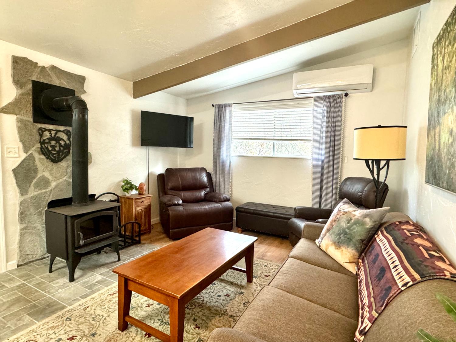 47515 Bissett Station Road Oakhurst, CA 93644 - Photo 11 of 59 a living room with furniture and a flat screen tv