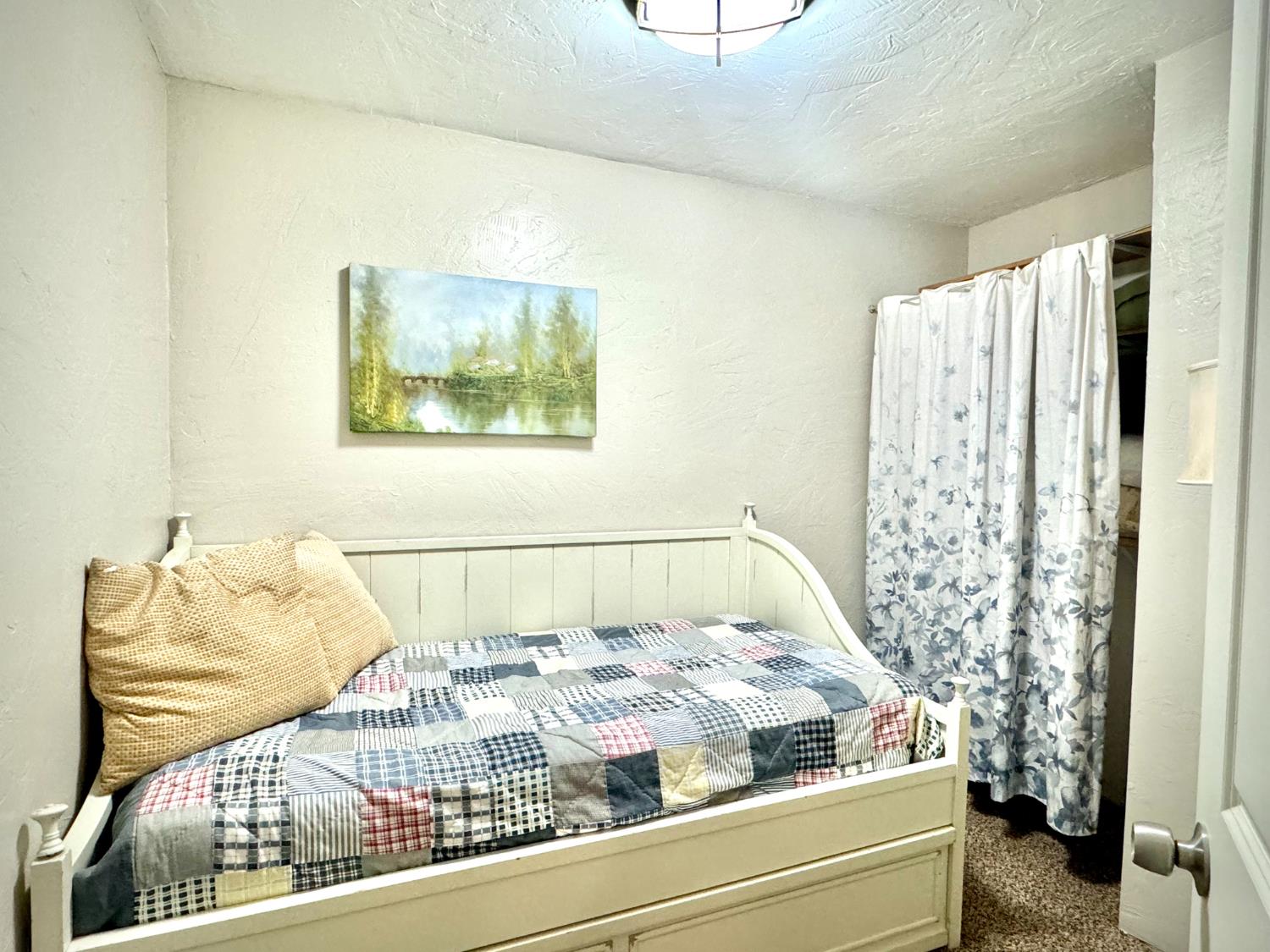 47515 Bissett Station Road Oakhurst, CA 93644 - Photo 14 of 59 a bedroom with a bed and a painting on the wall