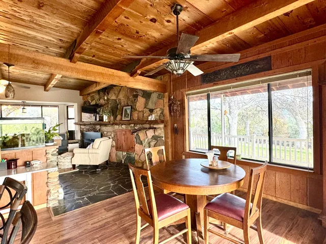 a view of a dining room with furniture window and outside view