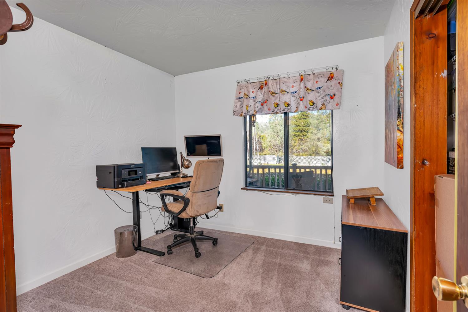 47515 Bissett Station Road Oakhurst, CA 93644 - Photo 55 of 59 a view of a workspace with furniture and a window