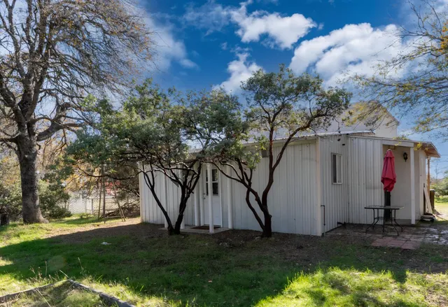 a backyard of a house with lots of green space