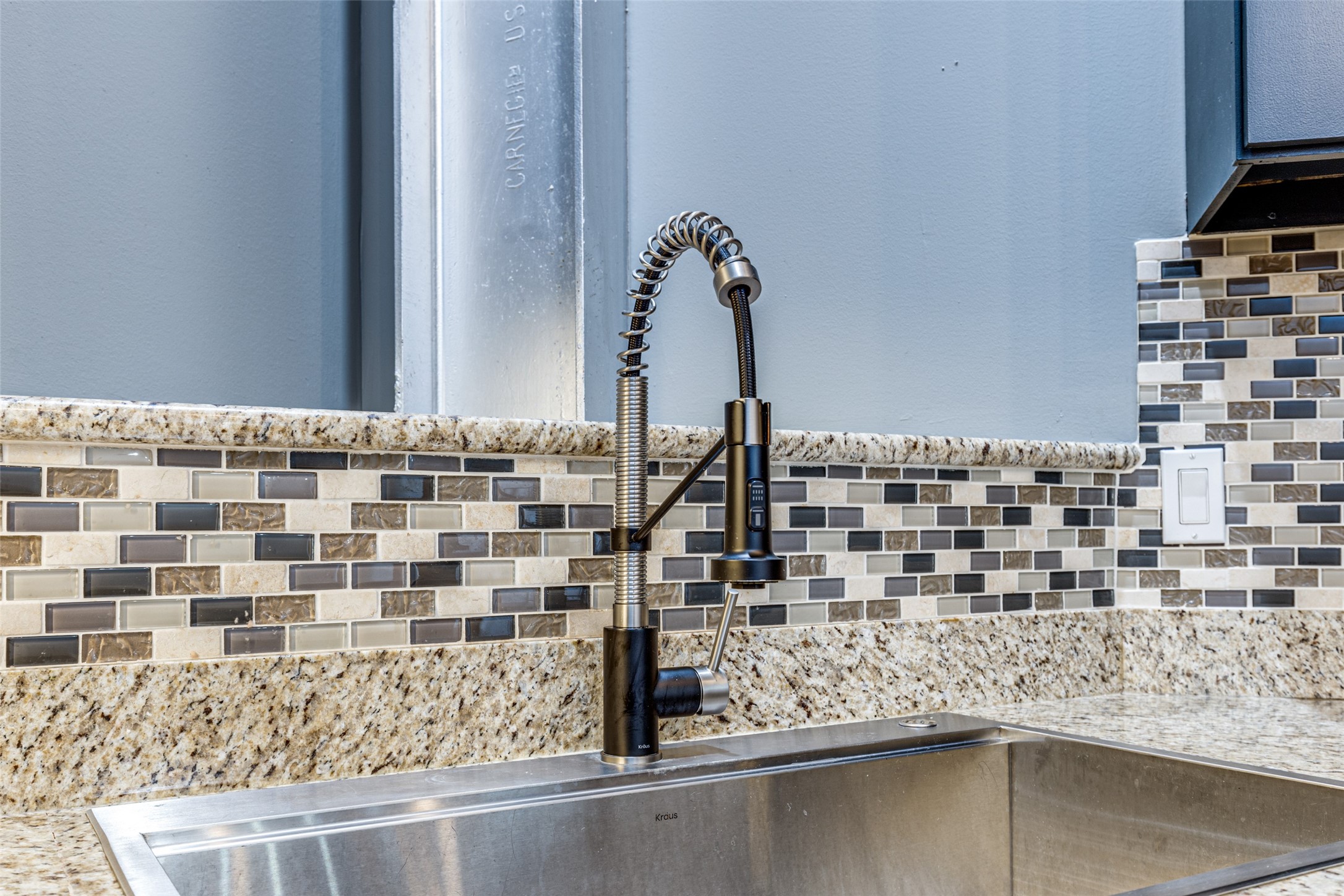 1312 Live Oak Street, Unit 223 Houston, TX 77003 - Photo 10 of 31 Close-up of designer backsplash and sink area with sleek modern finishes.