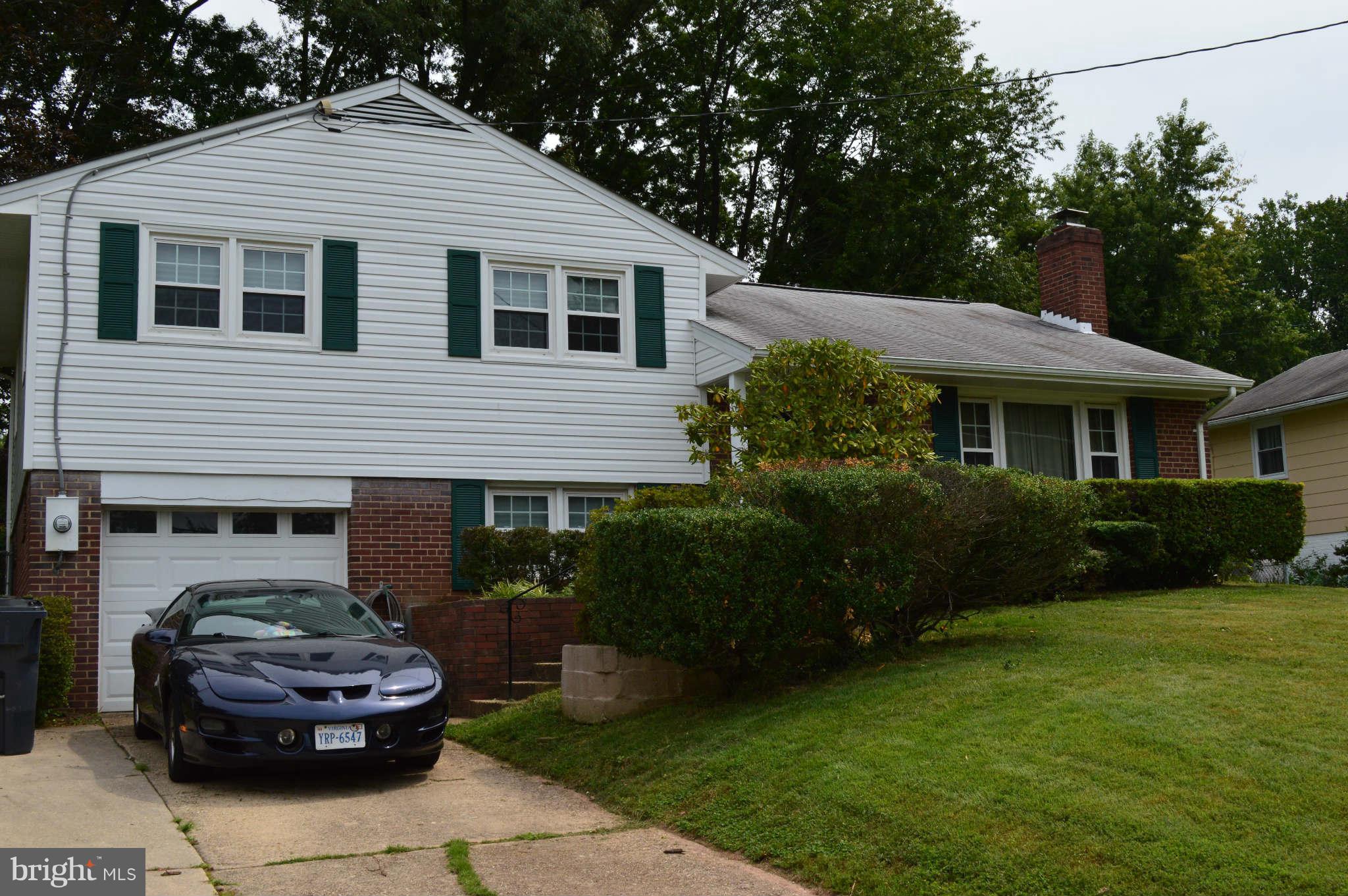 5916 Atteentee Road Springfield, VA 22150 - Photo 2 of 24 a front view of a house with a garden