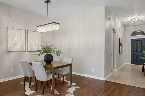 a dining room with furniture and window