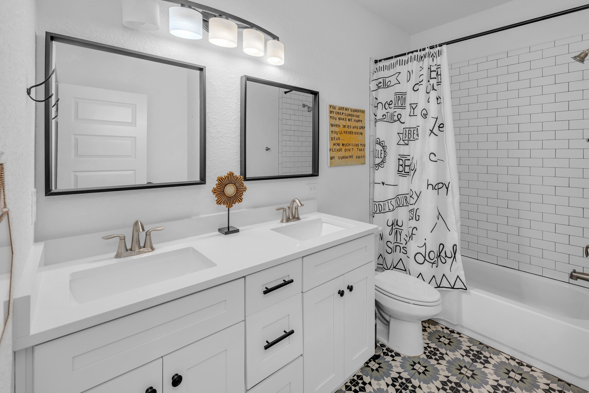 16512 Fetching Avenue Manor, TX 78653 - Photo 24 of 39 Full bath featuring double vanity, toilet, shower / bathtub combination with curtain, and a sink