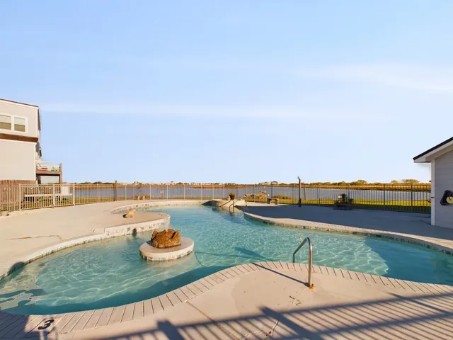 a view of an ocean with city from a terrace