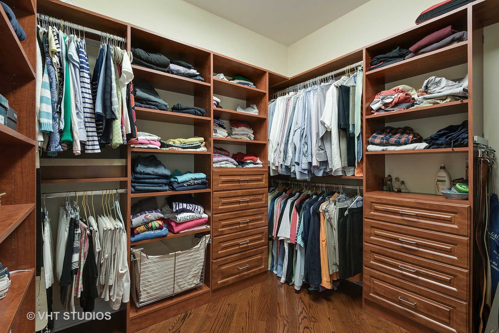 1353 Tower Road Winnetka, IL 60093 - Photo 14 of 33 a view of walk in closet with clothes and shoes