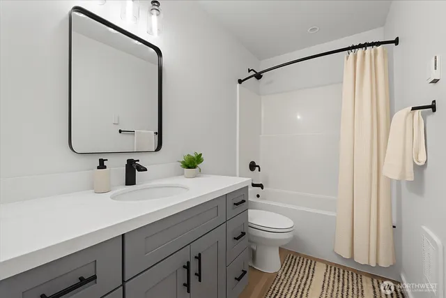 a backyard of a house with fountain table and chairs