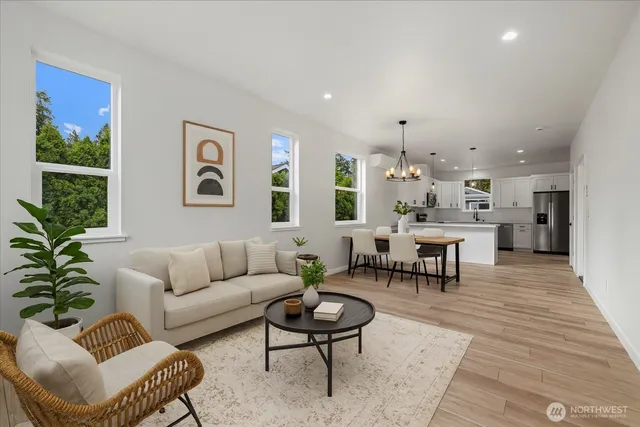 a living room with furniture and a large window